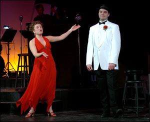 Maribeth Hill rehearses a scene with Zach Lahey for the revue
My Way, A Musical Tribute to Frank Sinatra, which opens tonight at the Toledo Repertoire Theatre.
