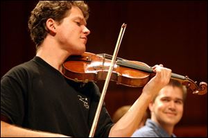 Violinist Corey Cerovsek will join the Toledo Symphony this
weekend in concert at the Toledo Museum of Art Peristyle.
