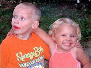 Five-year-old Dameatrius McCreary, shown with sister Breanna, 4, died after being struck by a car on Starr Avenue.