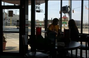 Brixx's owners acquired a liquor license at a cut-rate price through Dayton's community entertainment district. Business, the two people at lunch above notwithstanding, has been disappointing.