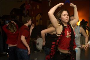 NBR sock25p Abbie Bates (13), of Delta, enjoys enjoys dancing with her friends at the 