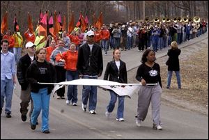 The combined Northview and Southview high school bands practice behind Southview High School.