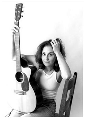Ann Arbor singer Whitt Hill s band is called the Postcards.