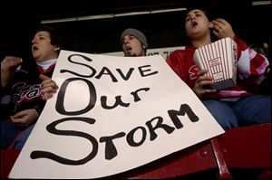 Kelly Launder, left, Ben Holder, and Sara Launder, came from Portage in Wood County to watch their favorite hockey team. Kelly said that attending a Storm game was something the family could do together. She said she always knew where the kids were on a Friday or Saturday night.