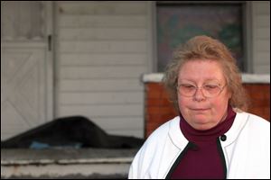 Beth Lewandowski, at 262 Hudson Street, in the Lagrange area, questions the benefit to Ohio from investments with Tom Noe. 