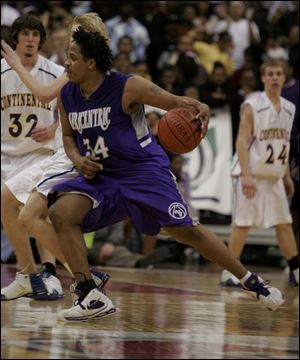 LaQuawn Perry of Columbus Africentric drives on Continental players in the Div. IV state semifinals.
