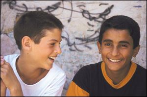 Promises, which will be screened at 6:30 p.m. tomorrow, is the story
of children such as Yarko, left, and Faraj growing up in Jerusalem.
