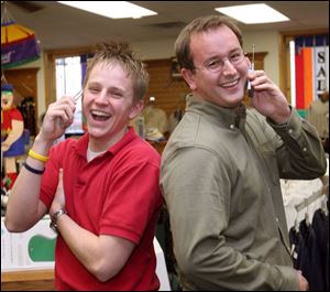 Shawn Eichenberg, left, says his ring tones are intended to amuse others as well as himself. Brad Ligibel uses ring
tones for functions as well as callers. For example, a text message prompts his phone to play the Halloween theme.