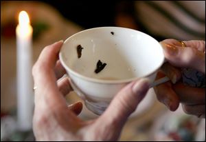 Ellen Kraus said she senses life trends and cycles
by studying the leaves left in the cup, and the person who left them.
