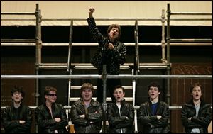NBR grease24p 1 Nathan Levin, top, performs during a dress rehearsal of Ottawa Hills High School's production of 