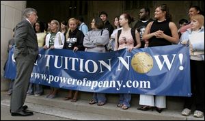 UT President Dan Johnson, left, and students have united to control rising college tuition.