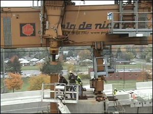 Faulty wiring in a control panel is blamed for allowing a cable
used to lift a support leg on the horizontal crane to snap. The
falling leg missed three workers on the I-280 bridge project.

