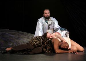 David Okerland, at rear, plays the Father, and Emily Wright, as
Eve, lays on top of Adam, played by Michael Quinchett.
