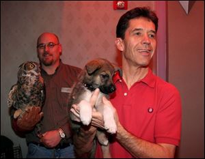ALL FEATHERS AND FUR: David Cooper of Nature's Nursery, left, and Jack Fynes of the Toledo Animal Shelter are 
