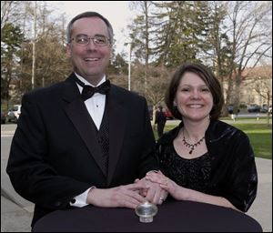 IL-LUMINATING: College President Bob Helmer and his wife, Linda, are wowed by the night of food, auction shopping, and a concert showcasing local talent.