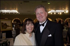 FOR LOURDES: Jim and Kay Murray enjuoy a moment of fun at the benefit.