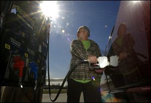 Rick Simon, who drives over100 miles a day, says he feels the crunch of high prices.
