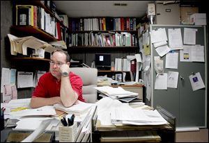 James Mehaffie works in one of the cramped offices in Bluffton's Town Hall. He says he's leaning toward new construction. 