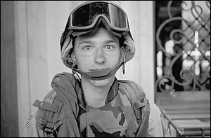Specialist Tom Susdorf at Gunner Palace near Baghdad.