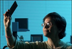 UT researcher Maria Coleman engineers a polymer soup from which Mr. Azad spins microscopic fibers.