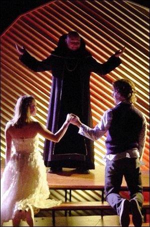 Ashly Fishell is Juliet, Kevin Pierson is Friar Lawrence, and Caleb Probst is Romeo in the National Players  production of Romeo and Juliet.
