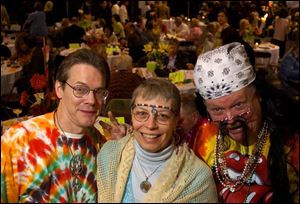 FEELIN  GROOVY: Mark and Deb McLaren and Roger
Dodsworth have a blast with the past during the gala.
