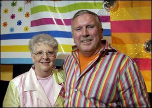 ALL YOU NEED IS LOVE: Sandy and Dick Fisher, make sure guests have a swinging time at Metcalf Field. 