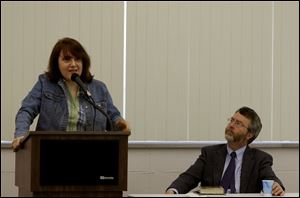 Mary Stockwell, right, associate professor of history, advises people to go the source and read Pope Benedict XVI's writings. Geoffrey Grubb, right, professor of religious studies, says Cardinal Joseph Ratzinger helped draft church laws allowing married Protestant priests to transfer into the Catholic Church.