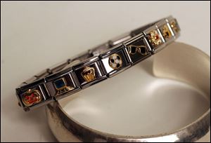 Modern charm bracelets such as this piece at David Fairclough
Fine Jewelers may include
novelty charms.