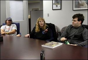 On one side of the debate are <i>Star Wars</i> fans Sean Dixon, left, of Sylvania, Kim Fink of Bryan, Ohio, and Brian-Joseph Baker of West Toledo.
