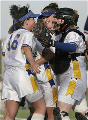 From left, Bridget Rattay, Hayley Wiemer and Audrey Tucholski celebrate victory. Wiemer and Tucholski had the key hits.
