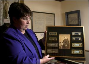 Barbara Berry, director of the Fulton County Historical Society, shows a photo of E.L. Hayes, one of Wauseon's founders and a Civil War veteran. The photo was found on eBay.