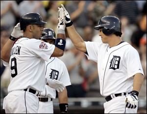 The Tigers' Magglio Ordonez, right, homered in his first game back in Detroit after completing a rehab assignment in Toledo.