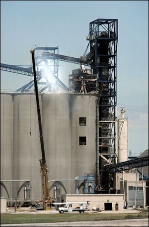 A crane was used to lift workers to view the damage.