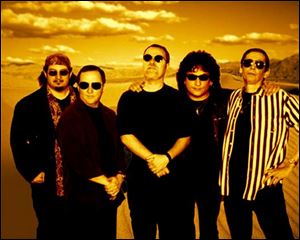When he's not fronting Blue Oyster Cult, Eric Bloom, center, is playing video games or reading science fiction. 