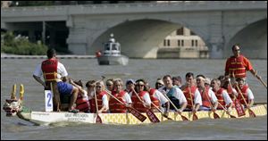 The 'Pillsbury Rowboys,' the J.M. Smucker Co. entry in the Great Maumee River Dragon Boat Festival, joked they were on a special training regimen for the competition - avoiding Smucker's cakes. The festival, in its fourth year, is organized by Partners in Education and drew 38 teams that paid $2,000 each to participate.