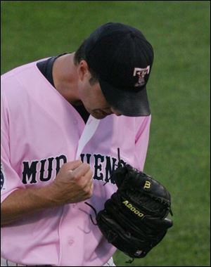 Hens pitcher Jason Grilli is pumped about getting the final out in the seventh inning. He pitched eight scoreless innings.