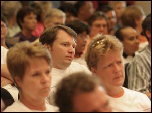 William Black, a supporter of Neighborhood Property Inc., listens at a Toledo City Council
meeting. An Uptown housing proposal was among the items on council s agenda.
