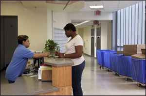 Ana Fackelman, left, discusses housing details with Glenda Smith, a residence hall adviser, at the new Ottawa House West.
