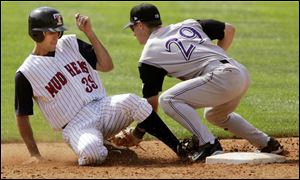 Mud Hens first baseman Jason Smith steals second base as Louisville second baseman Drew Anderson tries to make the tag during the sixth inning yesterday at Fifth Third Field.