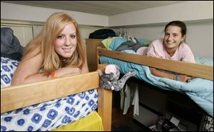 BGSU roommates Ashley Kiffmeyer, left, and Jennie Rubini find a comfort level in their dorm.