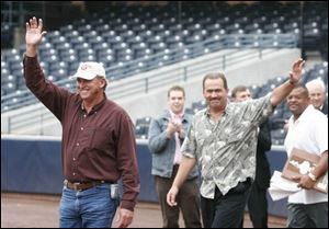Manager Larry Parrish, left, waves as the team s representative.
