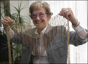 Petite Dolores Perlman bought this large necklace on a cruise   but she s never worn it.