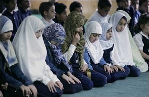 Students pray at the Masjid Saad School in Toledo in preparation for Ramadan, which will begin Wednesday.
