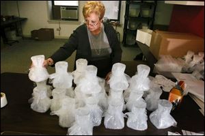 Pam Ciepichal packages a shipment destined for Canada.
