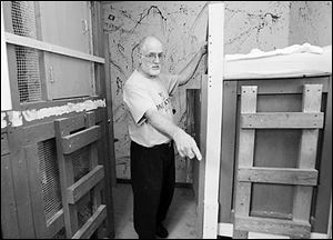 Michael Gravelle stands next to a bunk bed in the room where four of his adopted children slept at his Clarksfield Township home. He says the children were not abused.
