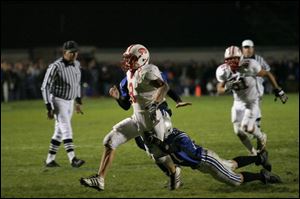 Elmwood's Ben Hammer brings down Eastwood's Jeremy Foster this time, but Foster ran for 185 yards and scored a touchdown.