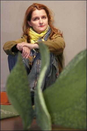 Milena Dopitova sits in front of
her work Sixtysomething.
