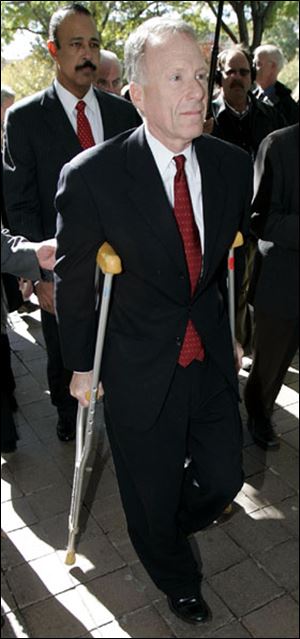 Ex-Cheney aide I. Lewis 'Scooter' Libby leaves  U.S. District Court after pleading not  guilty in CIA leak case. 