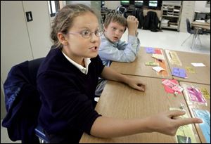 Emily Rouse accuses a classmate of jinxing her roll of the dice.